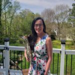 Rachel See with french horn at home, April 2020